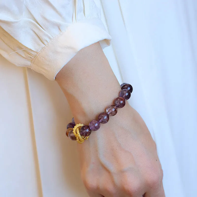 Purple crystal bracelet with animal zodiac beads and nine purple good luck elements