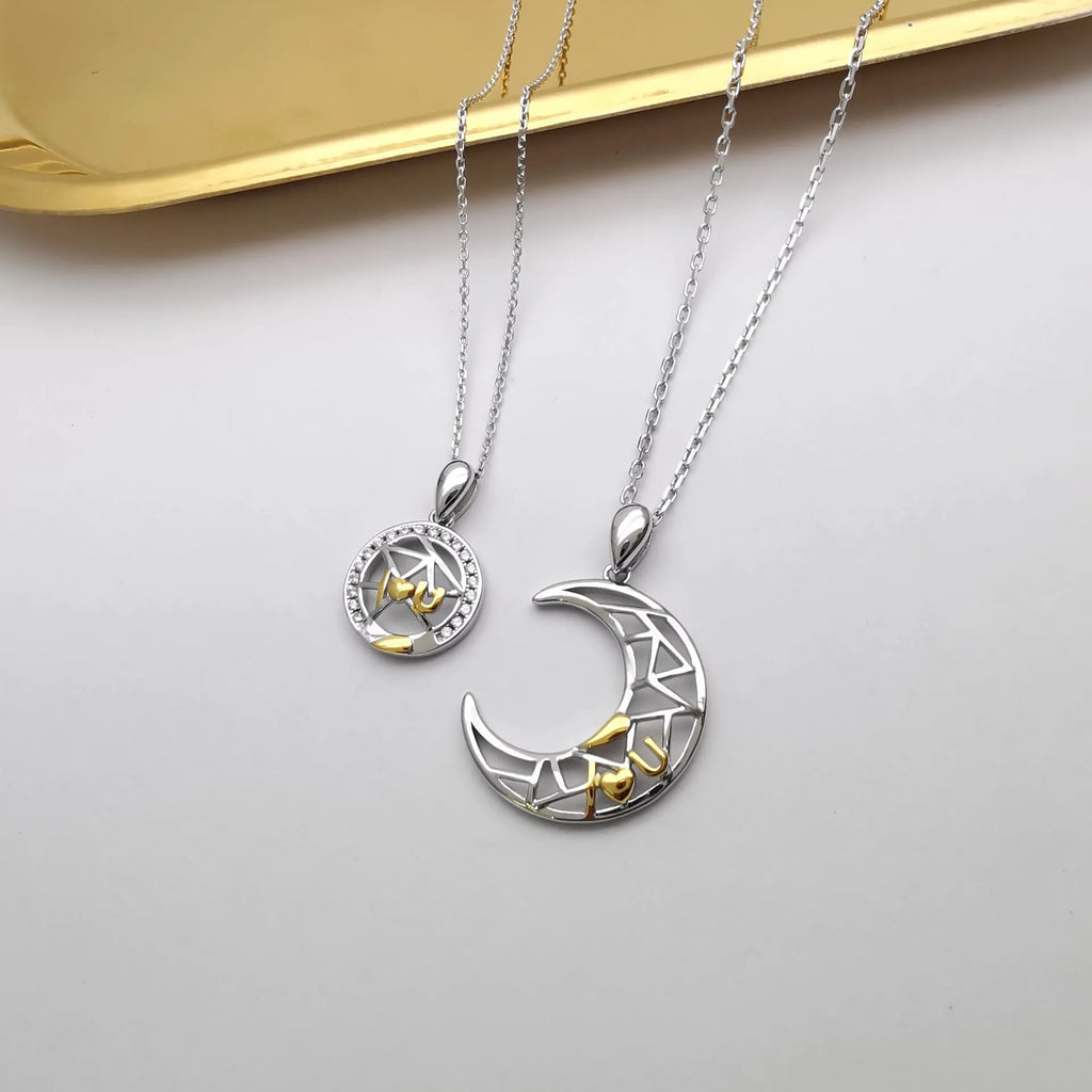 Copper sun and moon couple necklace with electroplated finish on a cross chain.