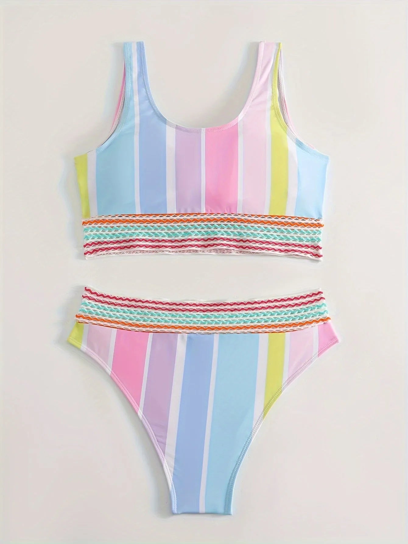 Striped women's sports bikini set with a top and briefs on a white background