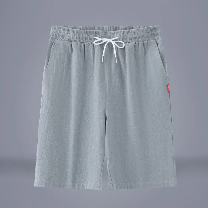 Cotton linen cropped casual pants with drawstring waist in solid Army Green colour on a hanger.