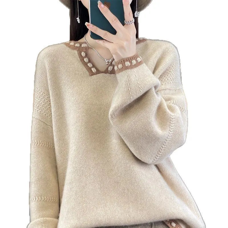 Women's camel coloured V-neck pullover sweater with long sleeves on hanger