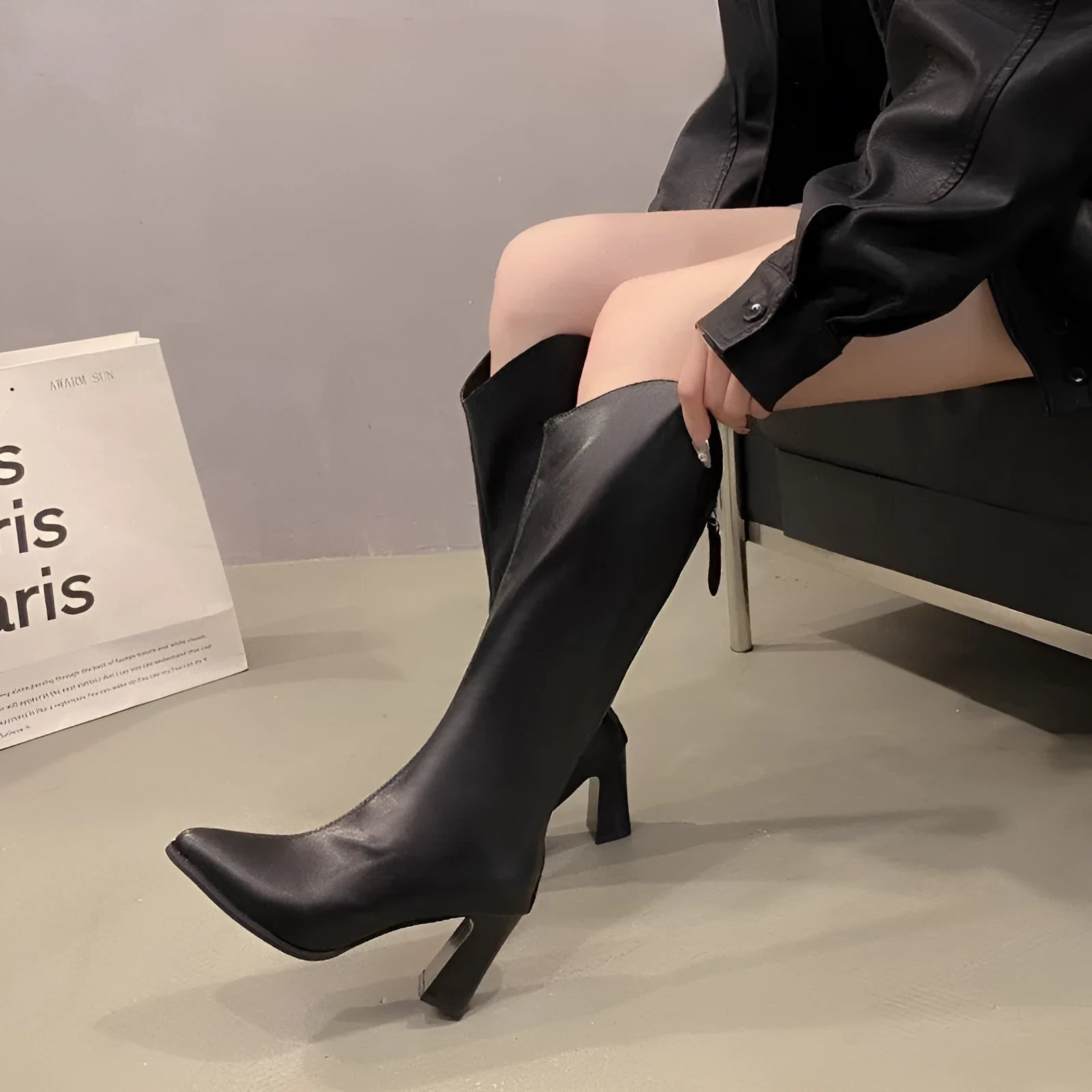 Women's plus-size black pointed-toe boots with chunky heel and back zipper, size range 34-43