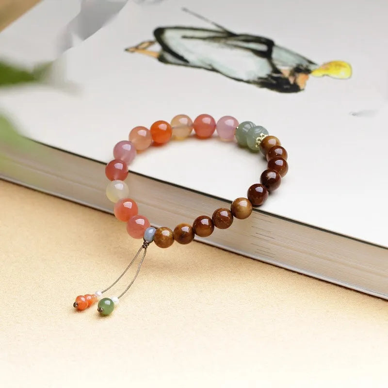 8mm diamond-shaped agate bracelet with natural persimmon colouration on woman's wrist