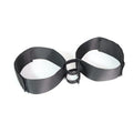 Black knitted appliance strap for women's sex toy tools on plain background