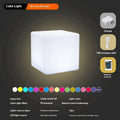 Modern square LED cube light stool in outdoor garden setting showing waterproof IP65 construction
