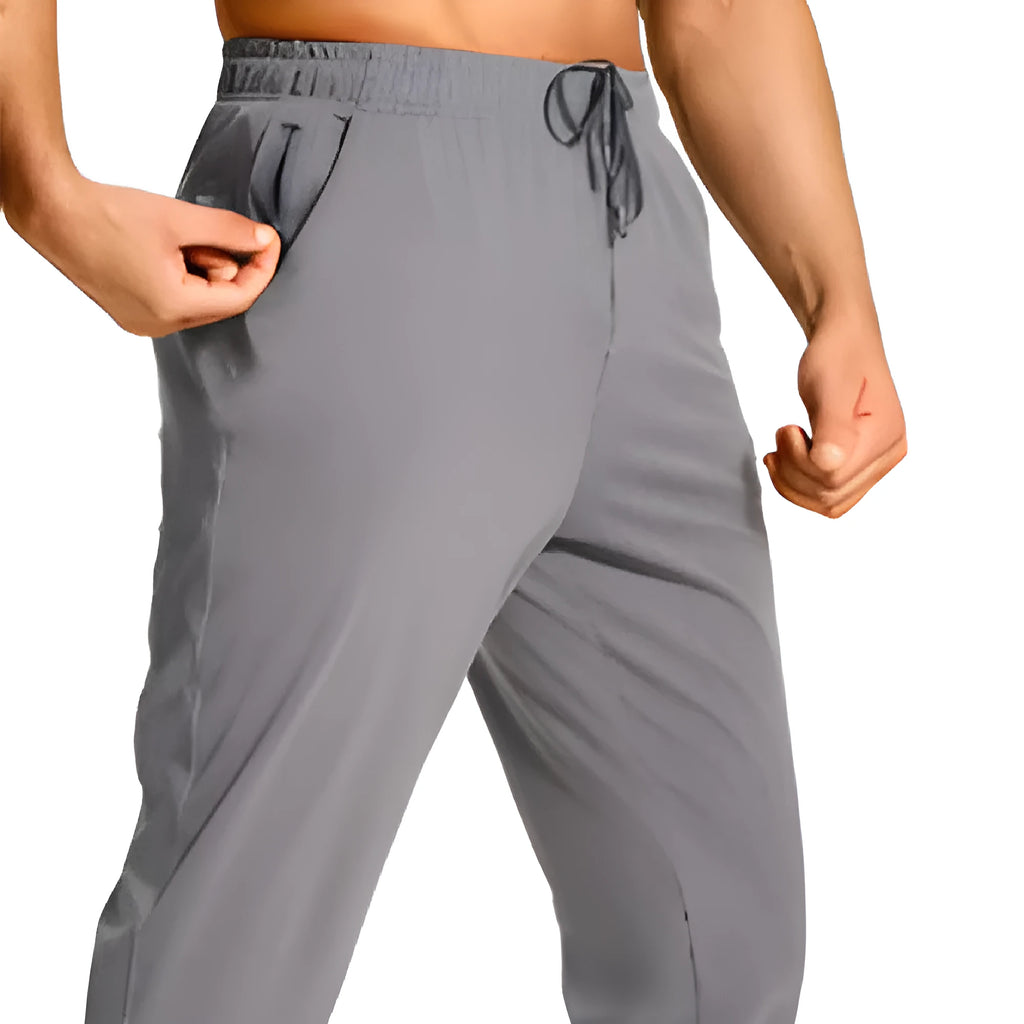 Man wearing loose-fit solid colour casual trousers in a leisure setting.