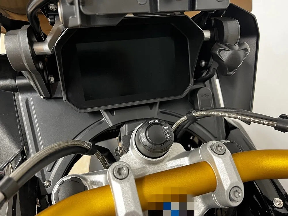 Black motorcycle cockpit fairing accessory for BMW R1250GS and R1200GS models.