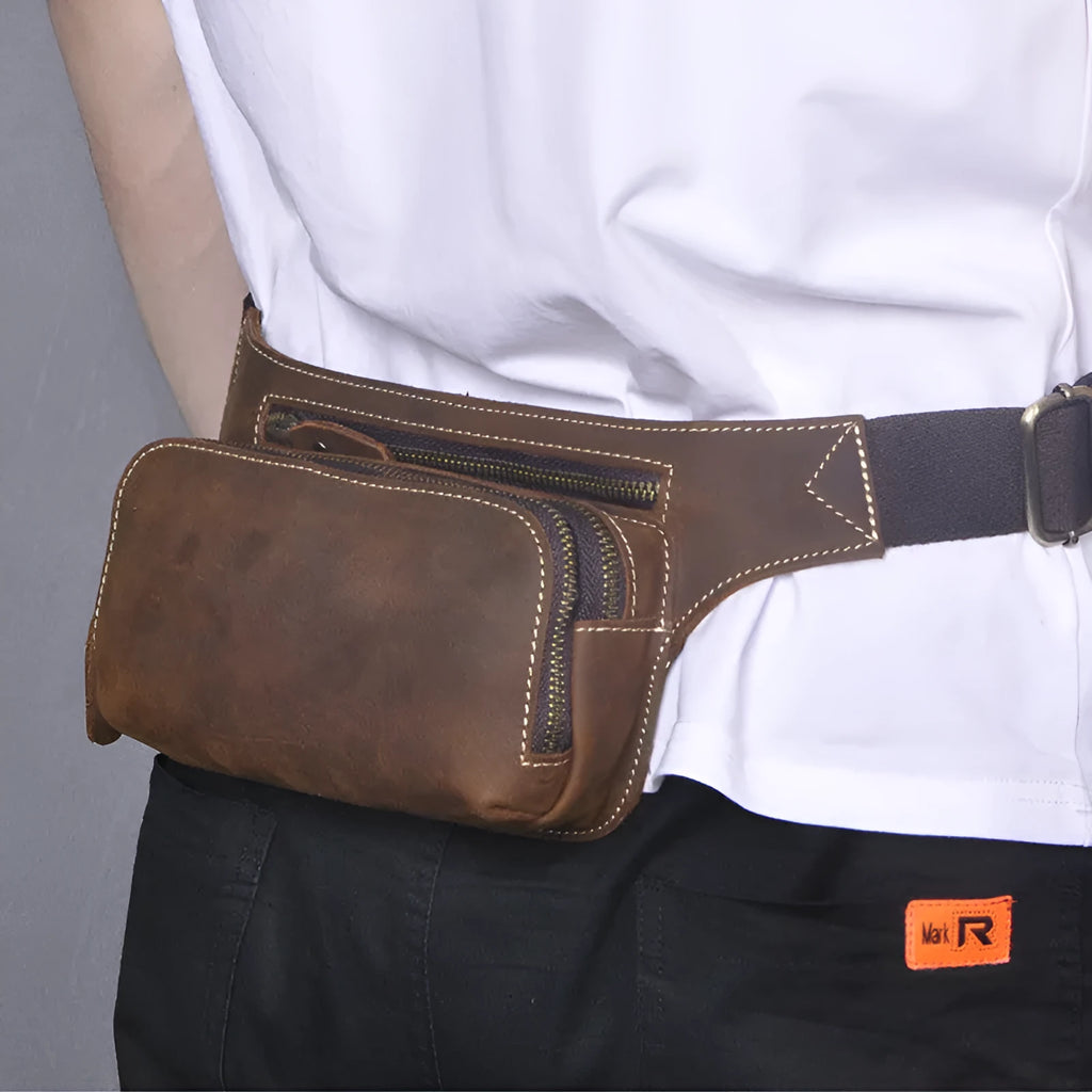 Brown top-layer cowhide leather men's sports waist bag with a zipped closure.