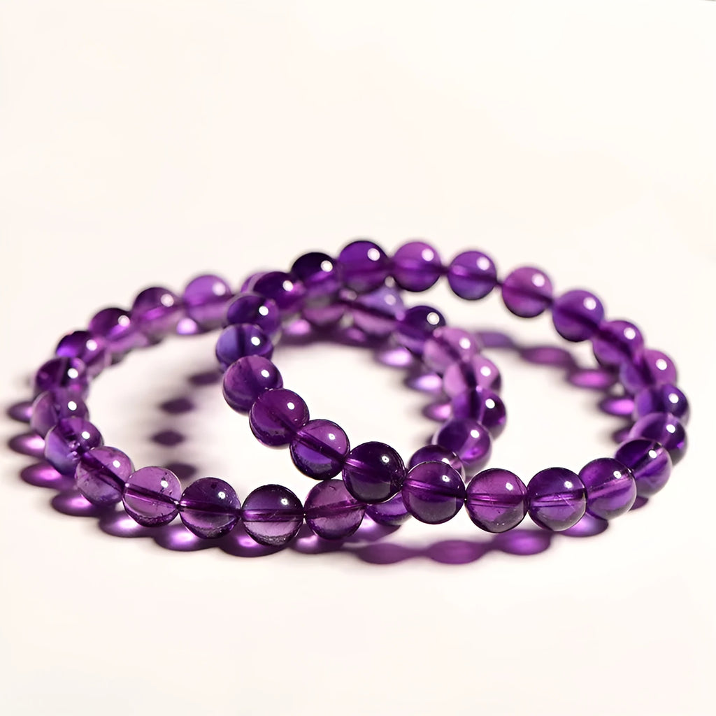 Natural amethyst scattered bead bracelet on a single strand, showing polished crystal stones.