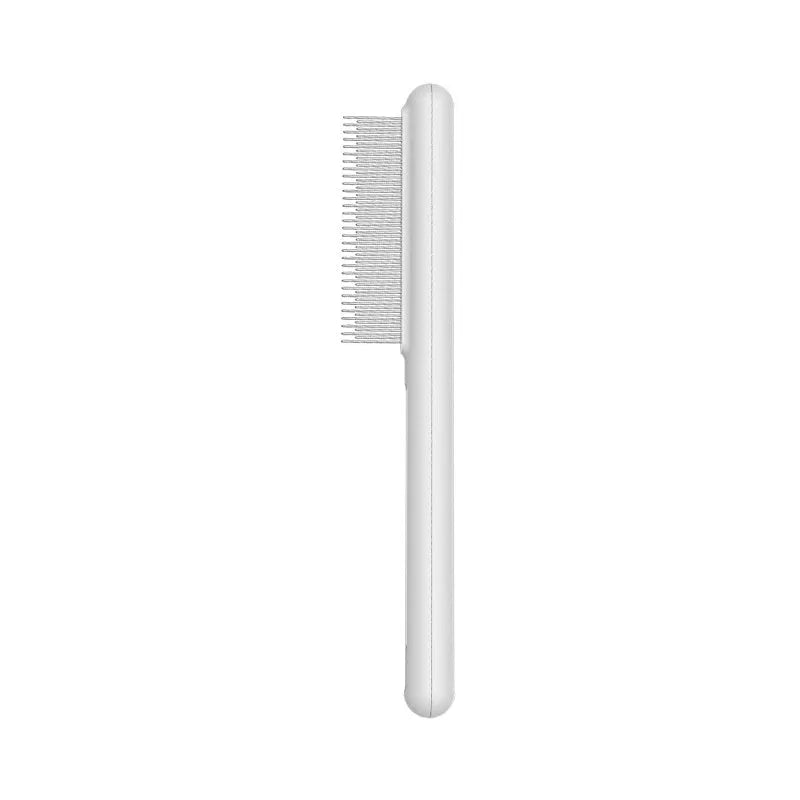 Green and white stainless steel cat comb with rounded teeth for grooming and flea removal