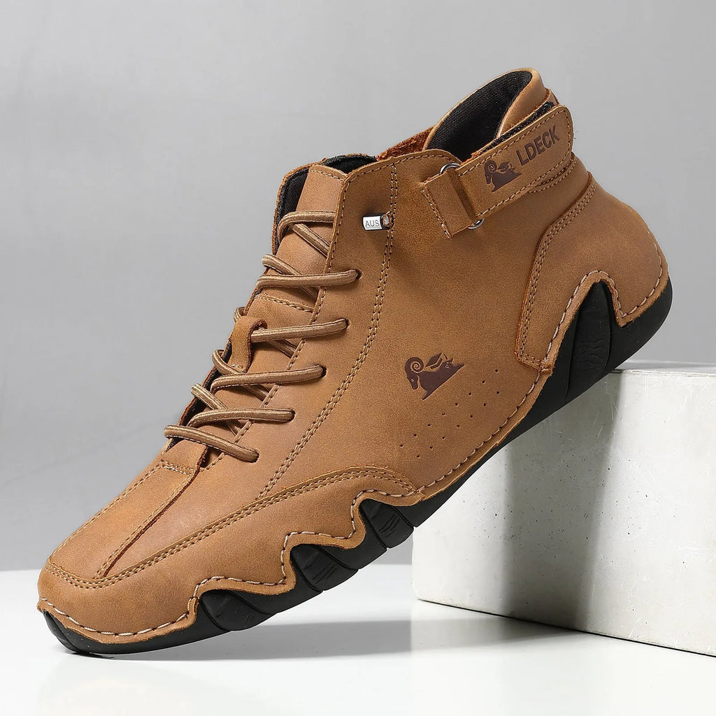 Men's khaki high top boots with octopus design, rubber sole, and pigskin ankle collar.