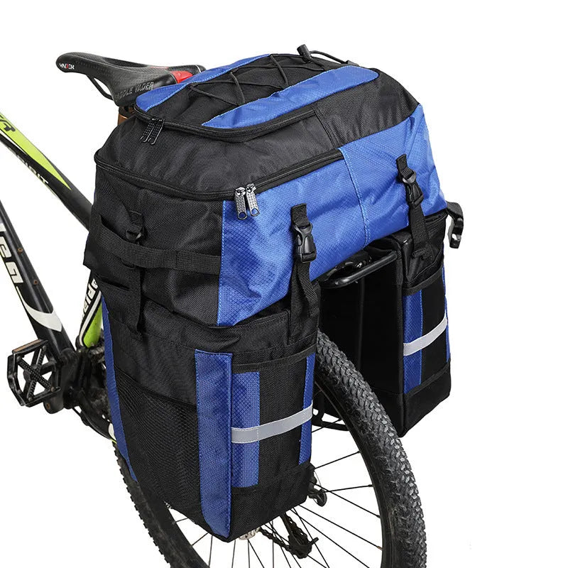 Green bicycle rear storage bag with 70 litre capacity mounted on a bike rack for touring.