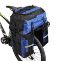 Green bicycle rear storage bag with 70 litre capacity mounted on a bike rack for touring.