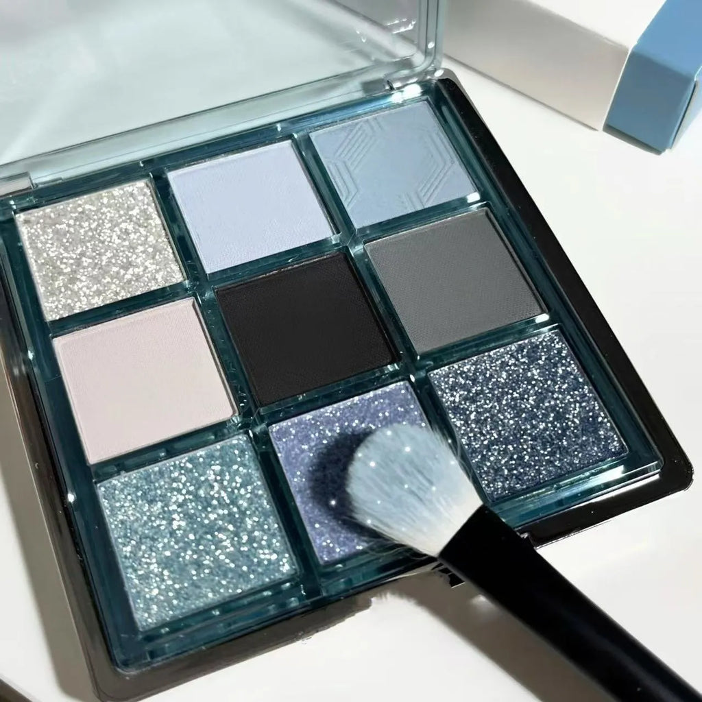 MUGELEEN nine-colour eye shadow palette open showing low saturation blue and complementary shades