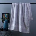 Pure cotton three-piece towel set showing bath towel, hand towel, and square scarf in flower pattern colours