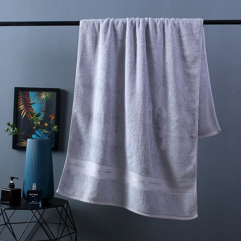 Pure cotton three-piece towel set showing bath towel, hand towel, and square scarf in flower pattern colours