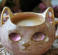 Pastel coloured resin geode mug with an embedded crystal-style cat figurine.