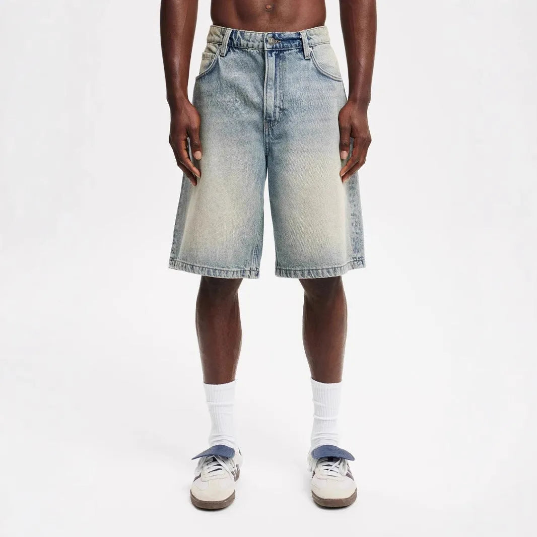 Men's loose fit straight leg jeans in light blue cotton denim with traditional non-stretch construction