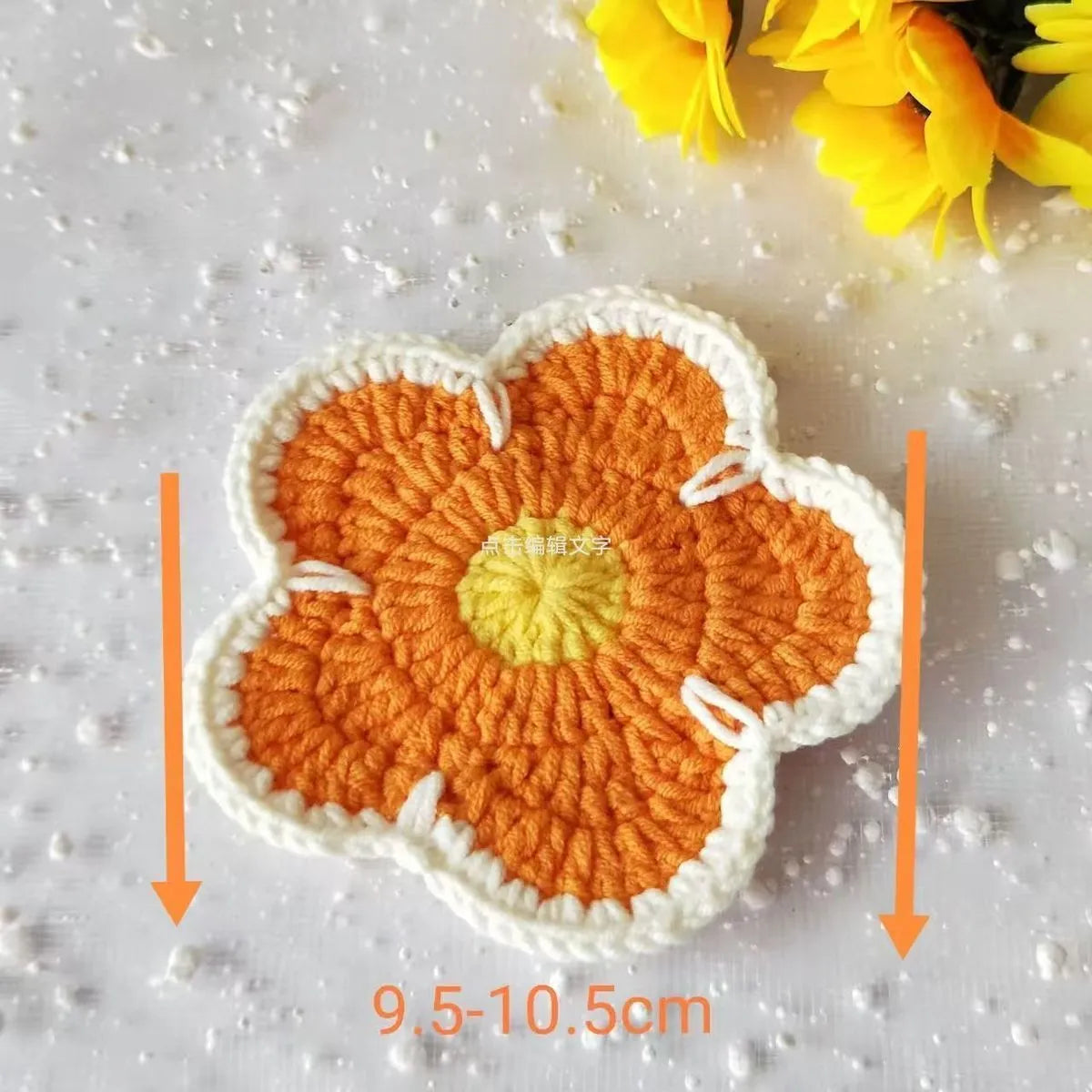 Five handmade woven flower placemats in blue, green, orange, pink and purple colours on a dining table