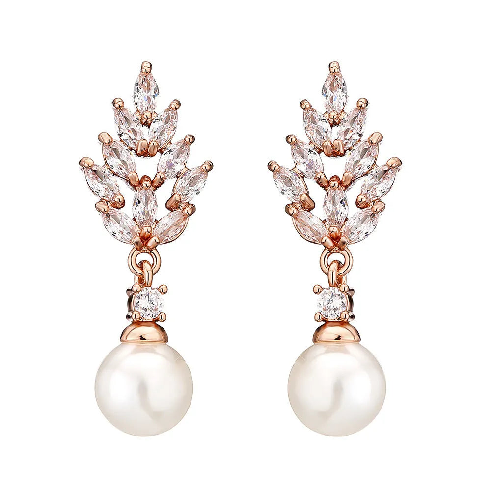 Geometric flower-shaped earrings with micro-inlaid zircon stones and pearl accents in gold, platinum, or rose gold plating.