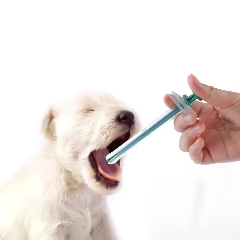 Two pet pill shooters with soft silicone tips in different sizes for cat and dog medication