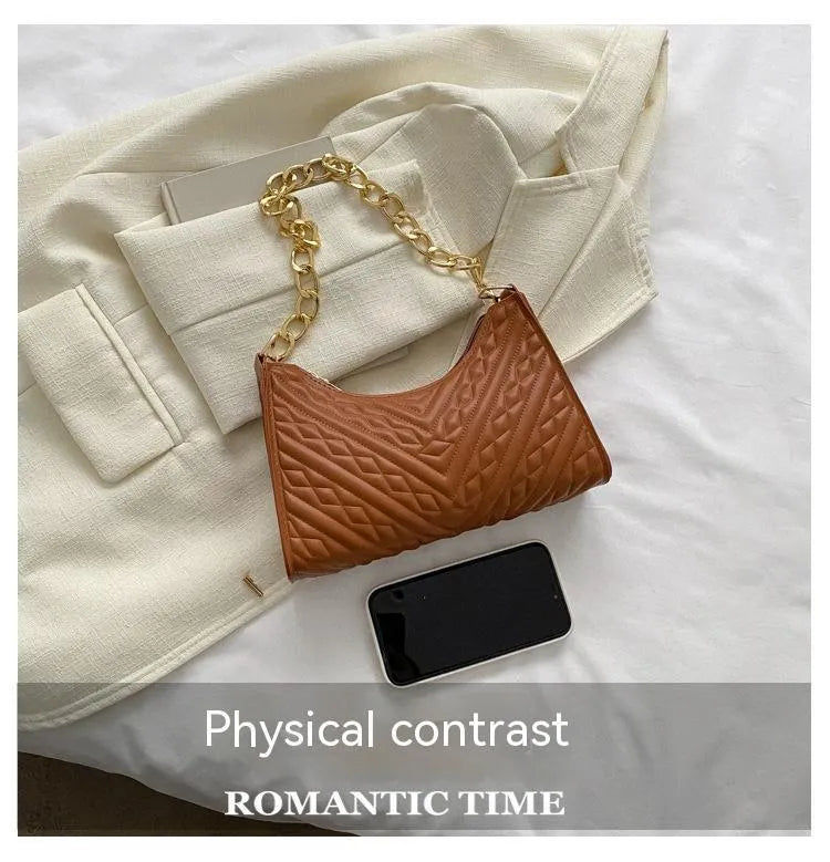 Brown pleated PU baguette shoulder bag showing its vertical square shape and chain strap.