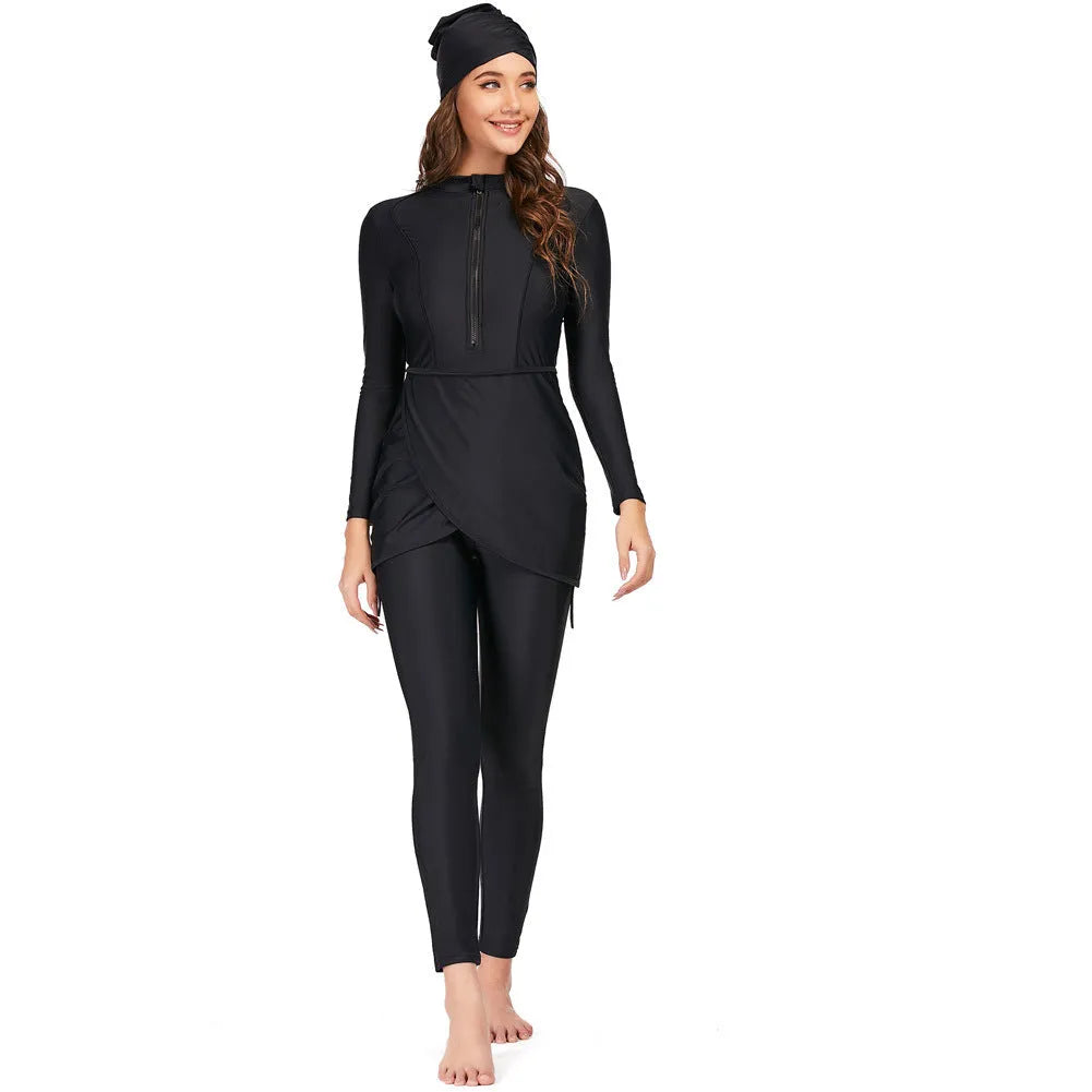 Black conservative Muslim ladies' two-piece swimsuit set on a mannequin, showing full-coverage top and pants design.