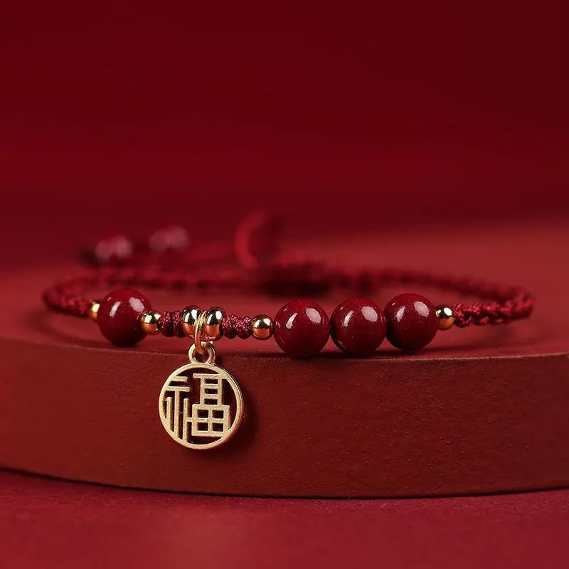 Cinnabar bracelet with braided rope and peach blossom charm for exam luck