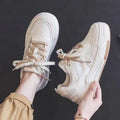 Spring low-top sneakers with rubber sole in beige and pink colour options on a white background