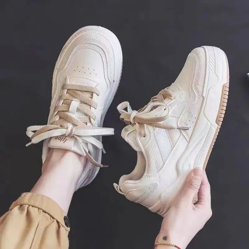 Spring low-top sneakers with rubber sole in beige and pink colour options on a white background