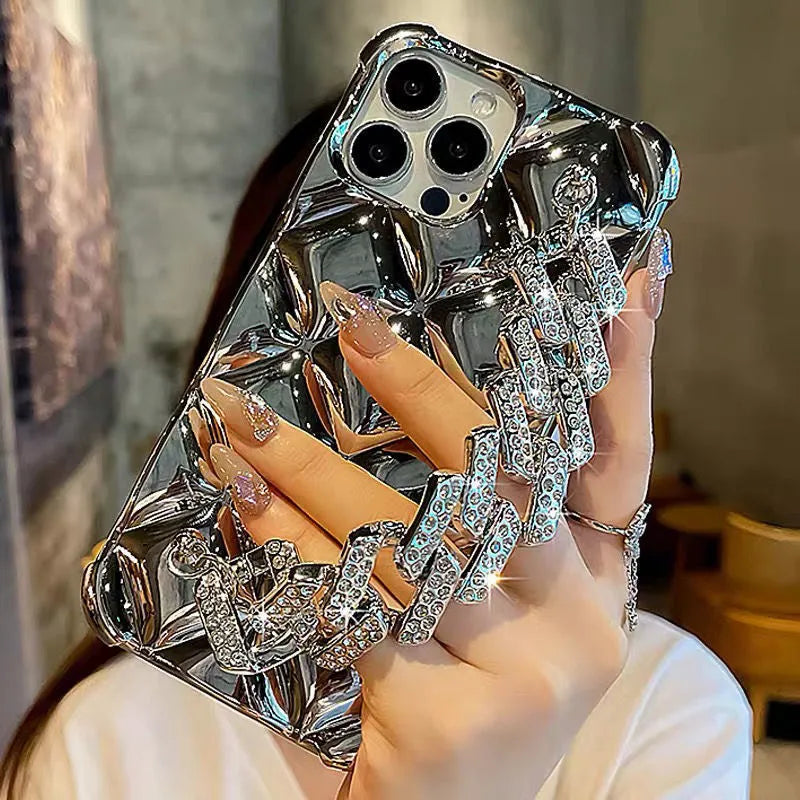 iPhone case with attached chain bracelet and rhinestone charm in plated rhombus pattern