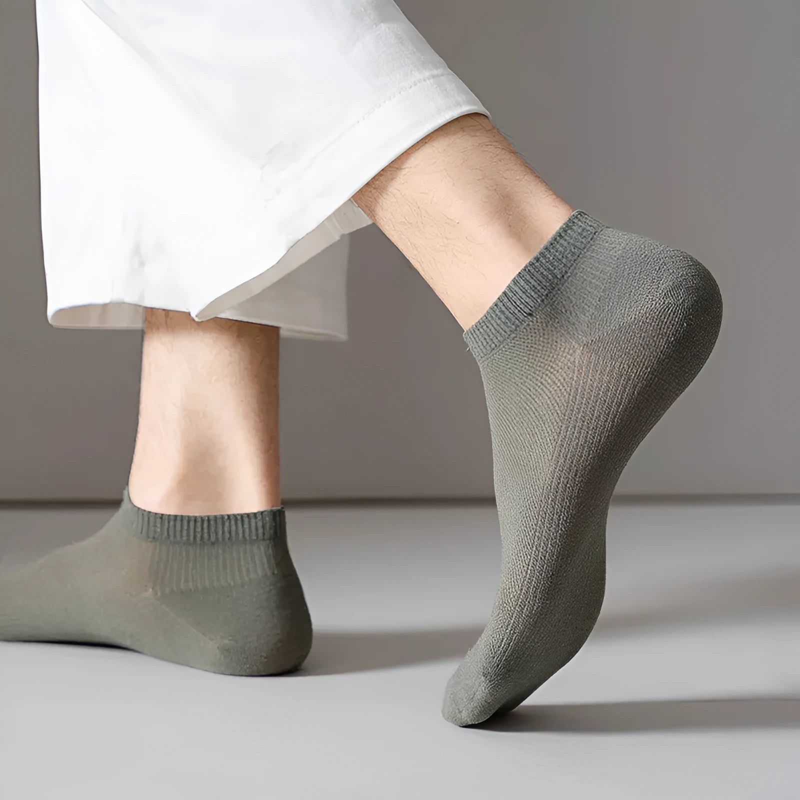 A pair of solid colour low-cut polyester boat socks laid flat, showcasing their simple design and one of the six available colour variants.