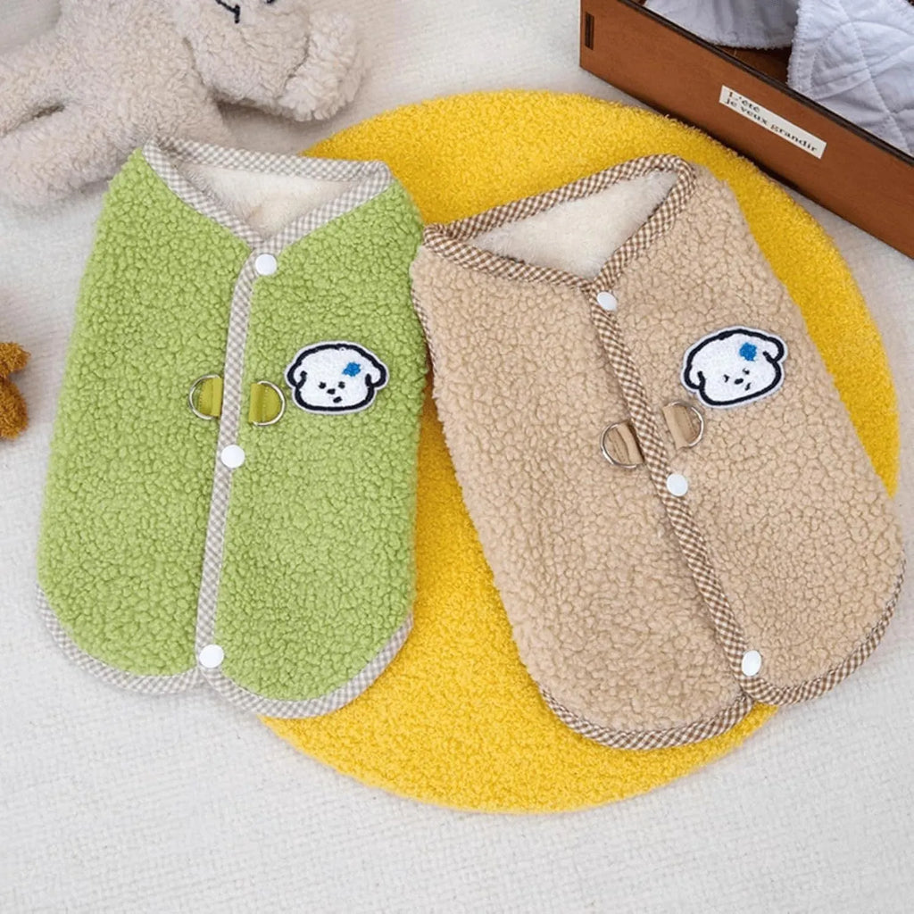 Green fleece dog vest with a metal leash ring on the back, for small pets.