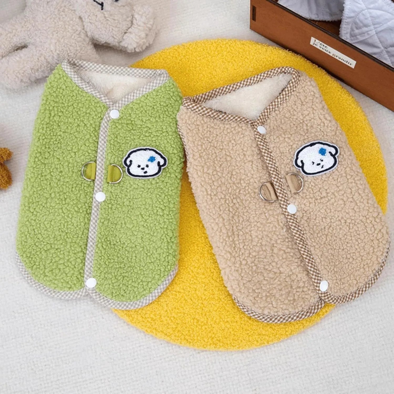 Green fleece dog vest with a metal leash ring on the back, for small pets.