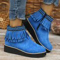 Women's dark brown suede wedge ankle boot with side zipper, tassel, and thick waterproof platform sole.