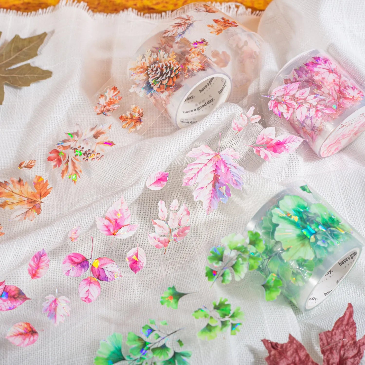 Roll of Deciduous Poetry Series clear PET decorative stickers showing leaf patterns in gentle ginkgo, blue fallen leaves, and other colours.