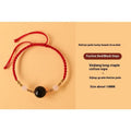 Handwoven Hetian jade lucky beads bracelet with red rope and cultural charm symbols in ethnic style