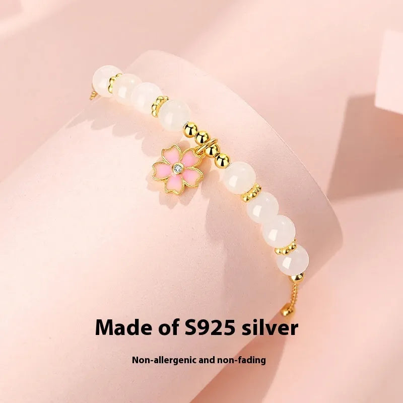 Women's silver bracelet with cherry blossom pendant and Hetian jade beads