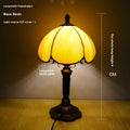 Beige fabric bedside lamp with simple modern design measuring 20cm wide