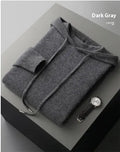 Man wearing a light grey hooded cashmere sweatshirt and matching casual trousers.