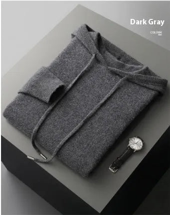 Man wearing a light grey hooded cashmere sweatshirt and matching casual trousers.