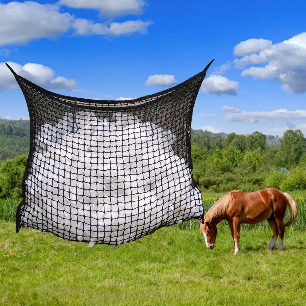Woven grid horse feeding bag in black hanging, suitable for cattle and sheep.