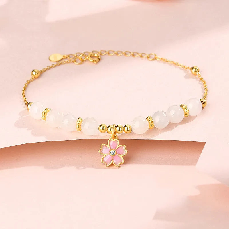 Women's silver bracelet with cherry blossom pendant and Hetian jade beads