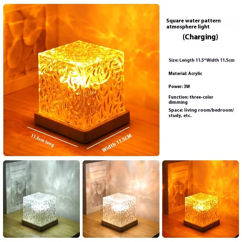 USB-powered crystal table lamp projecting blue water ripple light patterns on a wall