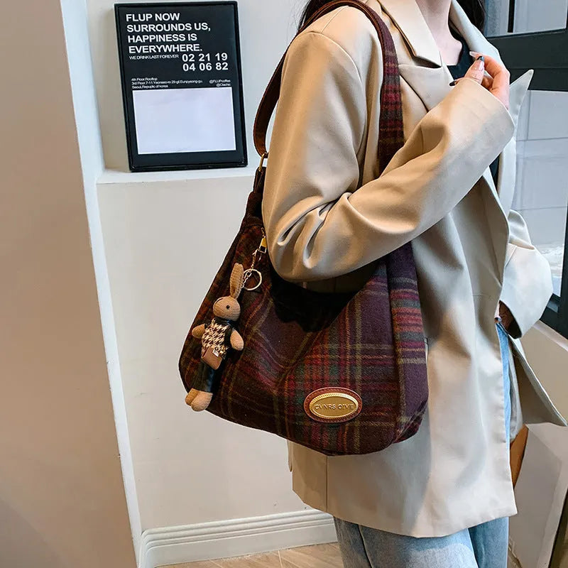Women's large soft wool crossbody shoulder bag in a horizontal square shape, shown in red, khaki, and brown colour options.