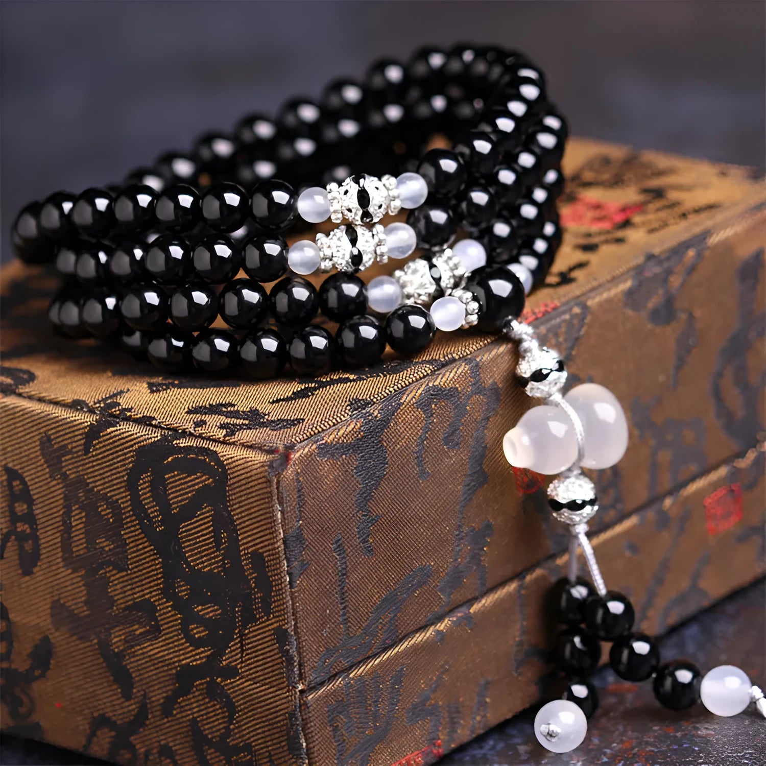 Black agate stone bead bracelet with 108 geometrically shaped beads and number element details