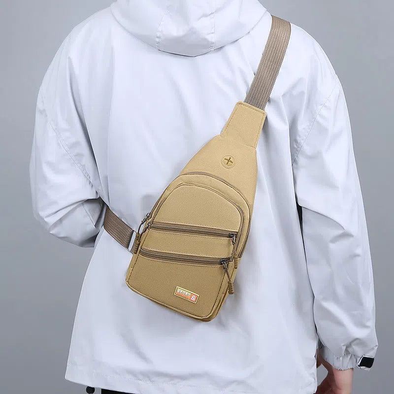 Canvas crossbody bag for men, lightweight waterproof with stitching detail, available in multiple colours