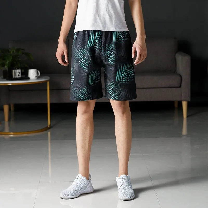 Men's ice silk beach pants with striped pattern showing loose fit and elastic waist