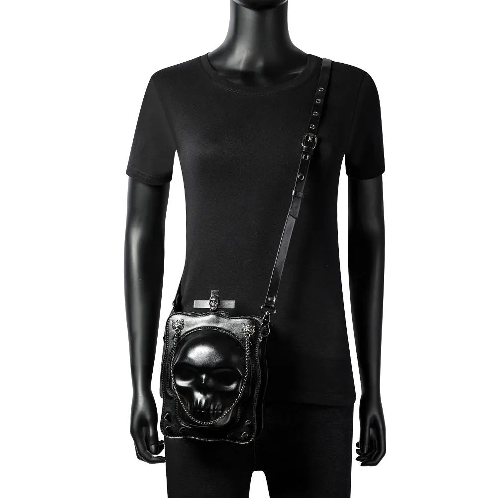 Black PU leather mini square crossbody bag with skull design, metal rivets, chain, and a zip opening.