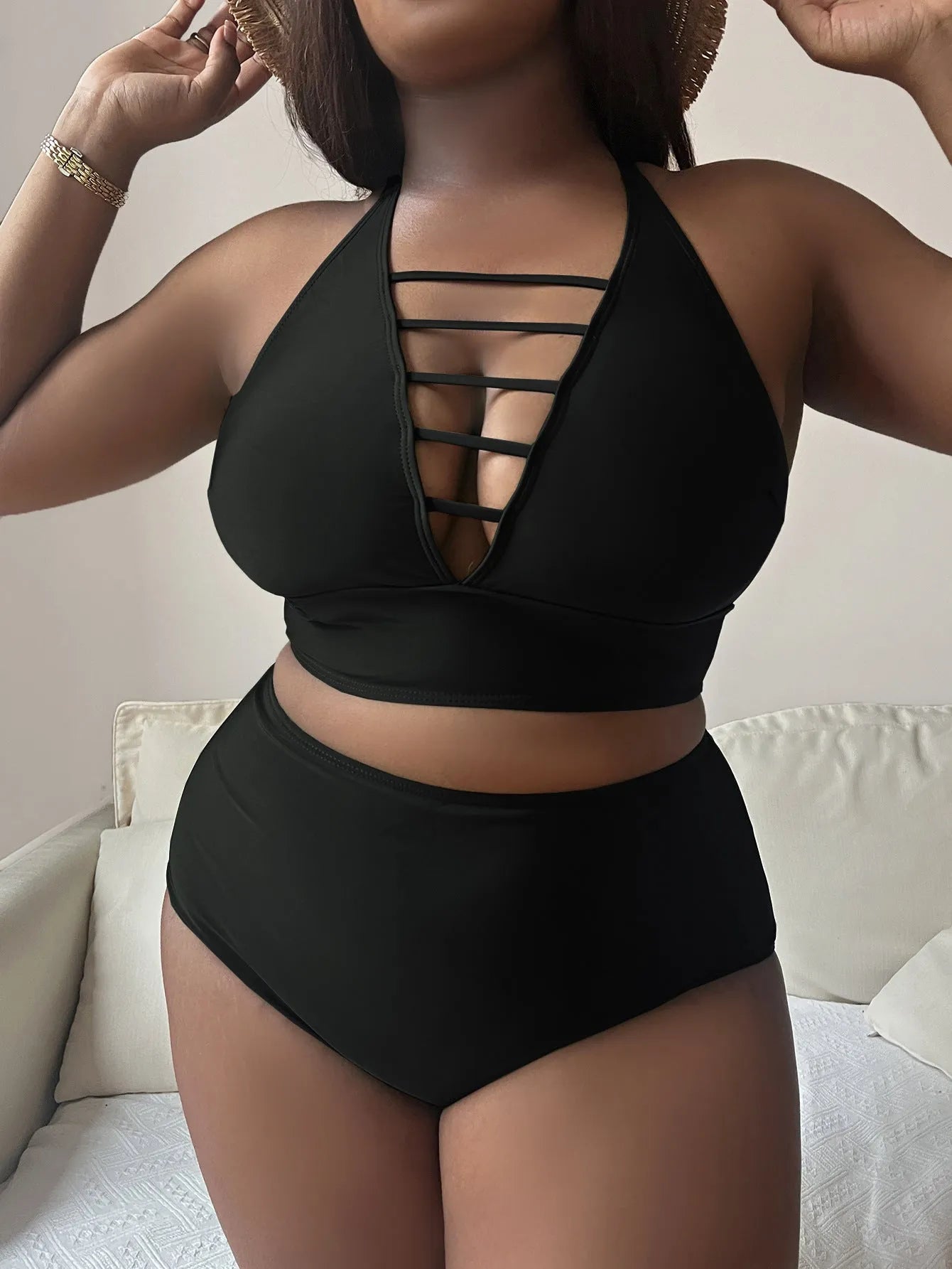 Plus size halter bikini with adjustable straps and high-waisted briefs in solid colour